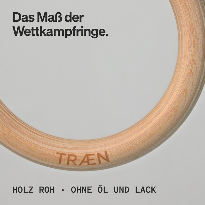 Nahaufnahme eines Birkenrings mit eingebrannter Wortmarke TRÆN